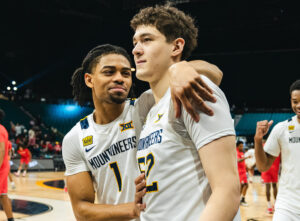 WVU rallies back to beat Stanford in OT in opening round of College Basketball Crown